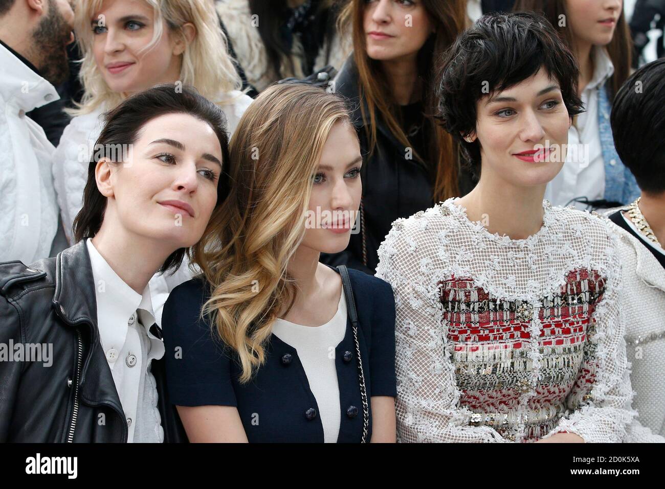 Model Erin O'Connor (L), American model and actress Dylan Frances Penn (C),  and actress Clotilde Hesme (R) attend German designer Karl Lagerfeld Haute  Couture Spring Summer 2015 fashion show for French fashion