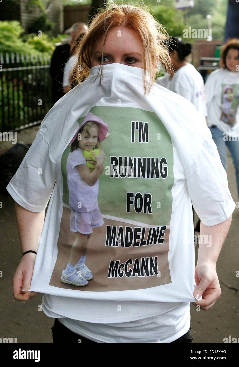 A runner shows off her specially designed T-shirt specially printed with a  picture of Madeleine McCann at the start of the Resolution 10K women run in  Glasgow, Scotland May 13, 2007. Hundreds