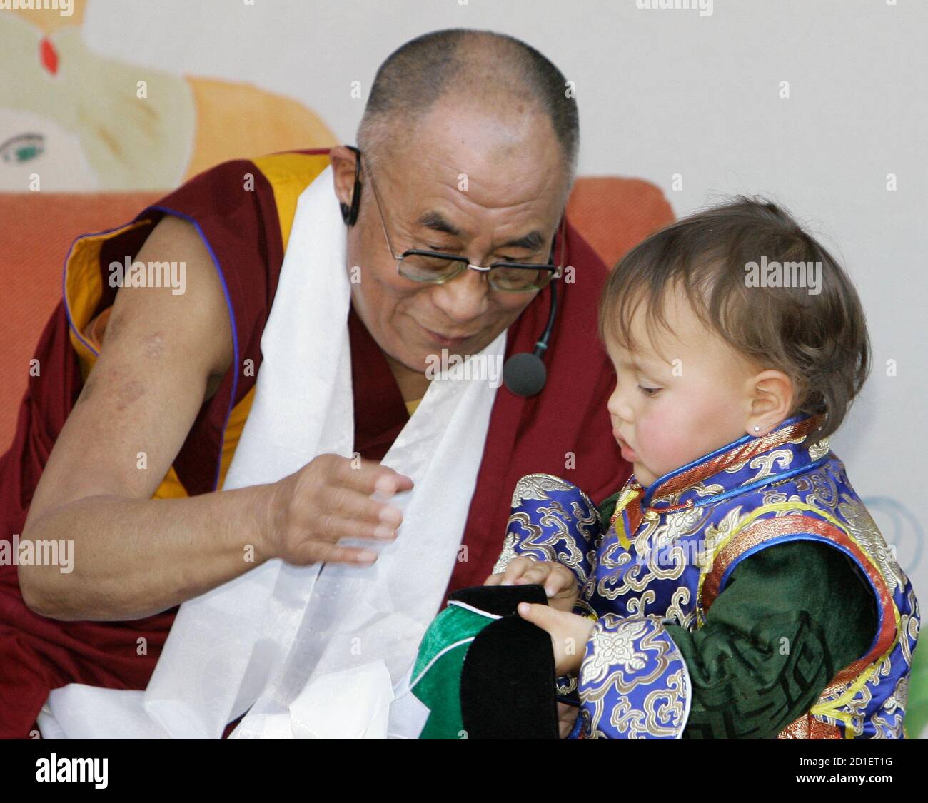 Tibet S Spiritual Leader The Dalai Lama Talks To A Child During His Visit In The Sos Children S Village In Hinterbruehl Some 25 Km South Of Vienna September 17 07 Sos Children S Villages