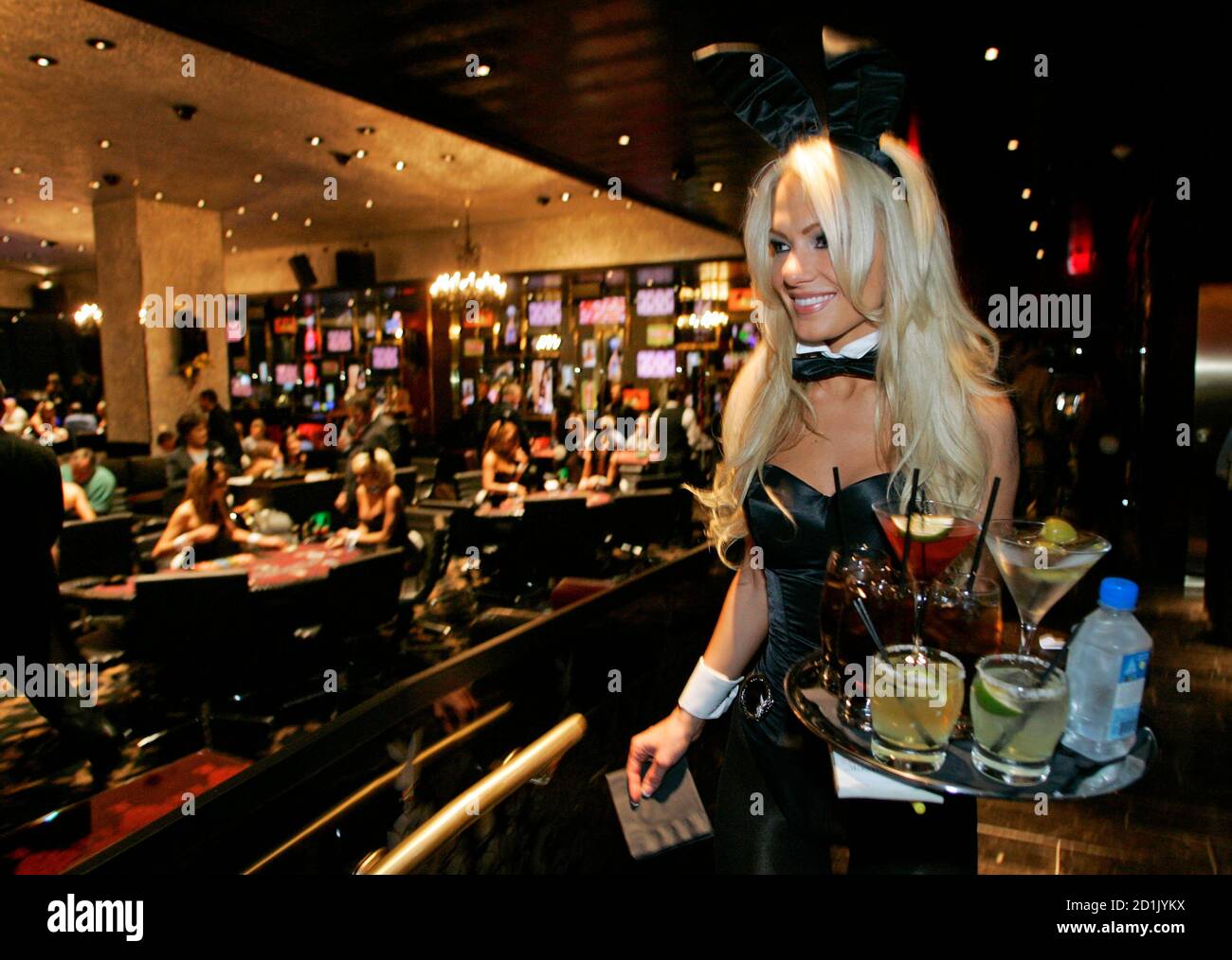 Beverage server Katie Putnam brings drinks to the gaming floor at the new  Playboy Club in Las Vegas October 5, 2006. The club, in the Palms Casino  Resort's Fantasy Tower, opens October