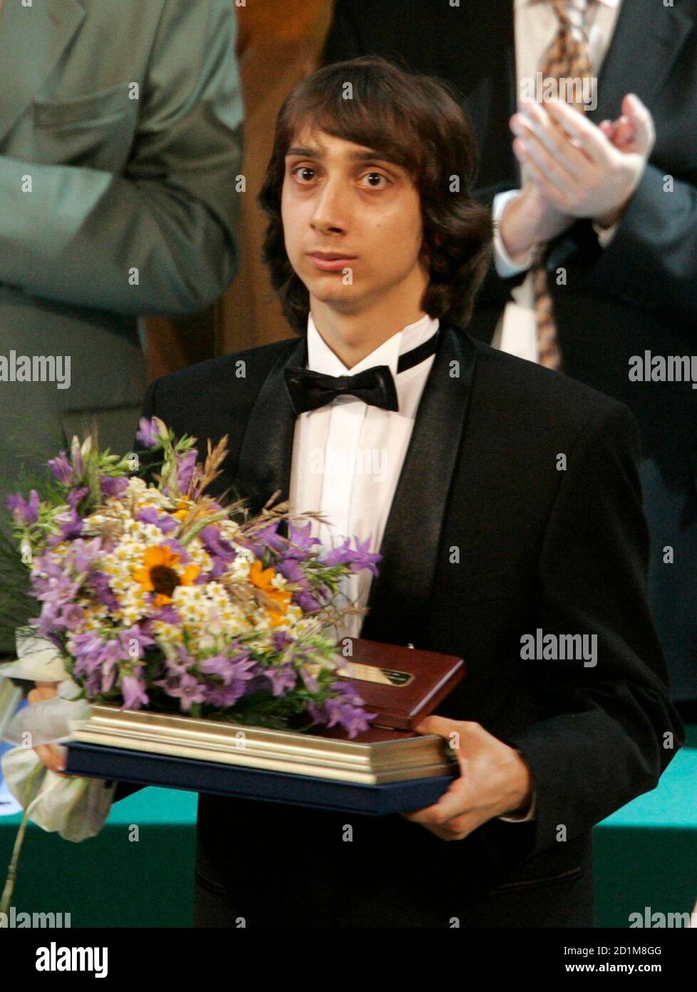 Miroslav Kultishev of Russia receives the silver medal in the piano  competition of the International Tchaikovsky Competition of classical music  in Moscow June 30, 2007. Over 200 young pianists, violinists, cellists and