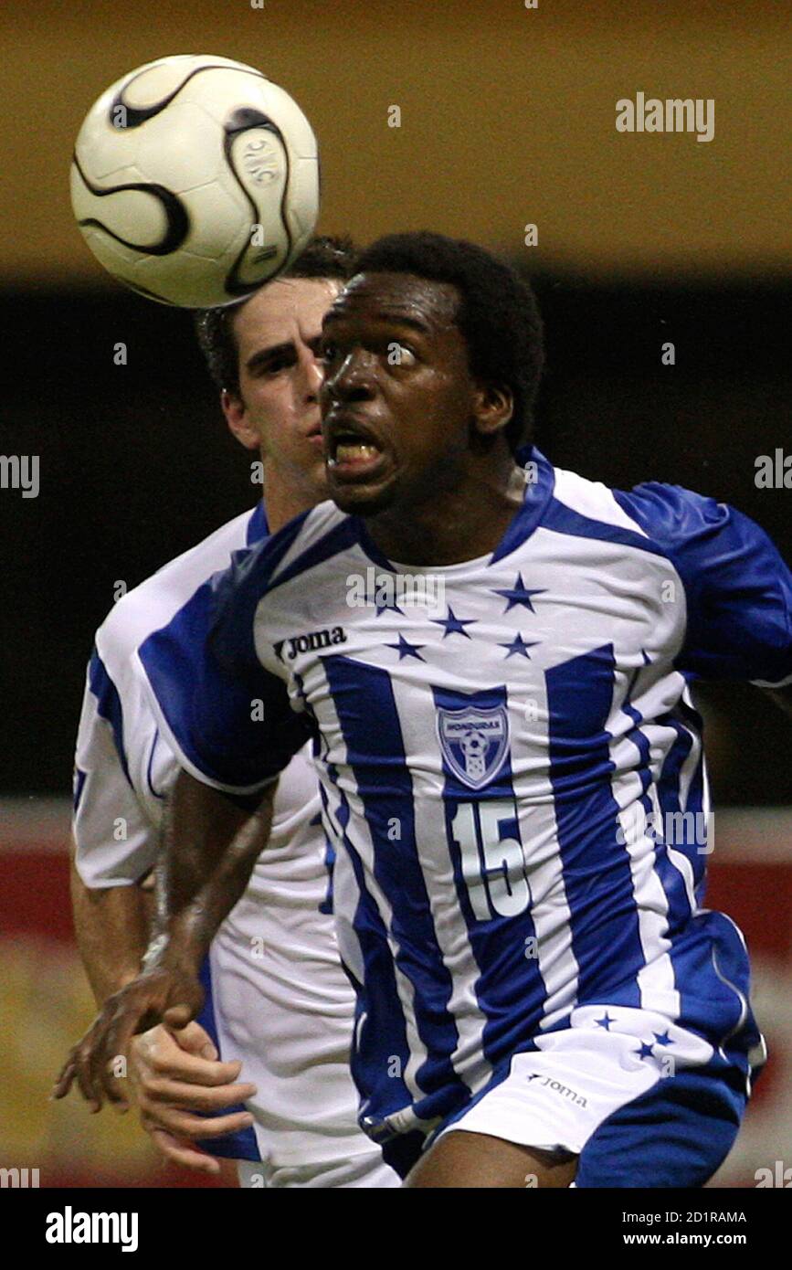 Honduras' Walter Martinez (15) runs after the ball with Puerto Rico's Danny  Irizarry during their CONCACAF