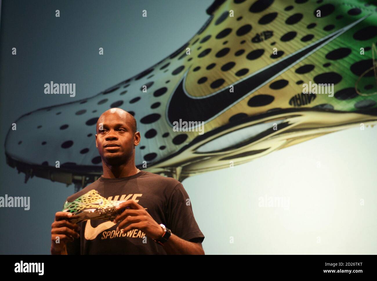 Sprinter Asafa Powell of Jamaica displays the Nike Zoom Aerofly during a  promotional event in Beijing August 12, 2008. Former world record holder  Powell says Jamaican compatriot Usain Bolt and American world