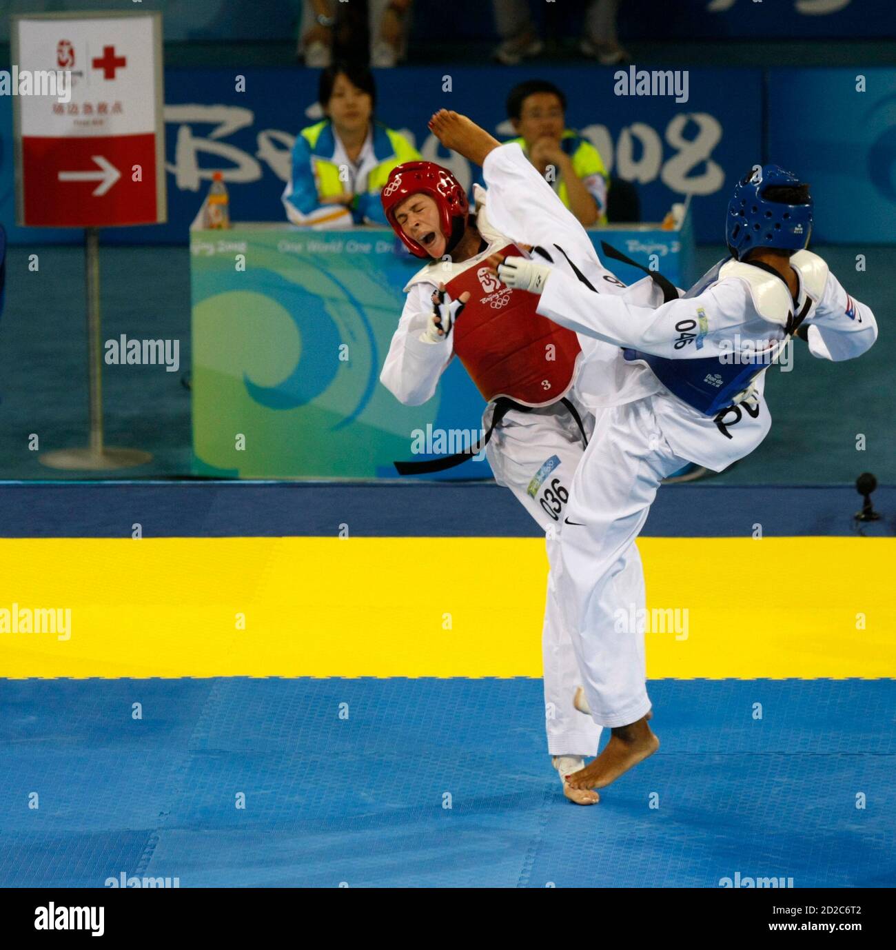 Asuncion Ocasio Rodriguez of Puerto Rico fights Sandra Saric (red) of  Croatia during the women's -67kg bronze medal taekwondo competition at the  Beijing 2008 Olympic Games, August 22, 2008. REUTERS/Issei Kato (CHINA