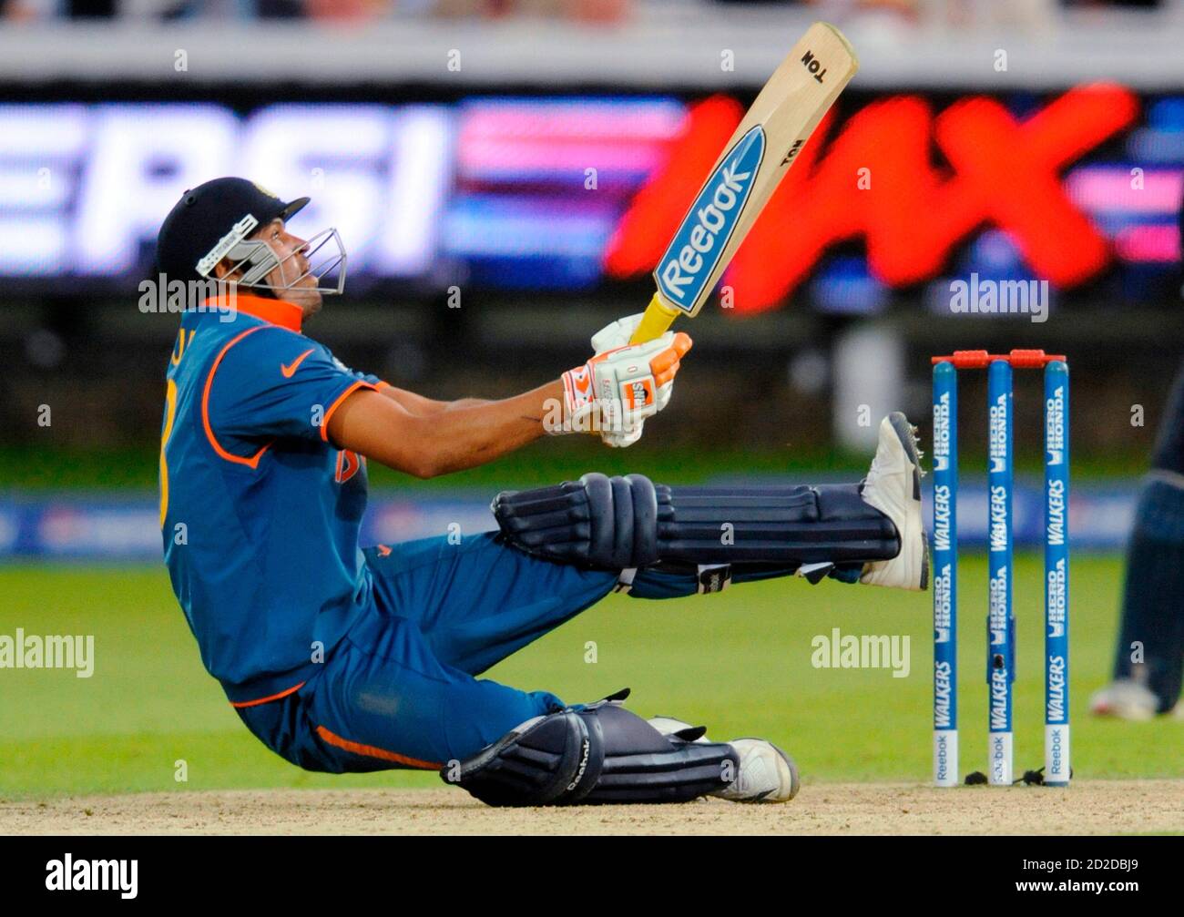 India's Yusuf Pathan falls to the after he hit shot against England in the ICC World Twenty20 cricket super eight match at Lord's cricket ground in London June 14, 2009.