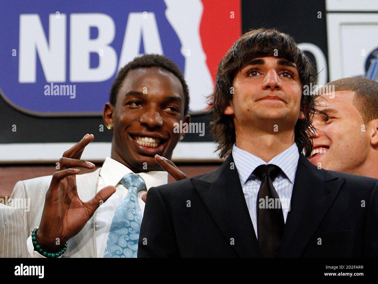 Players Ricky Rubio from Spain (C), Hasheem Thabeet (L) and Blake Griffin  (R) joke together on stage before the start of the 2009 NBA Draft in New  York, June 25, 2009. REUTERS/Lucas