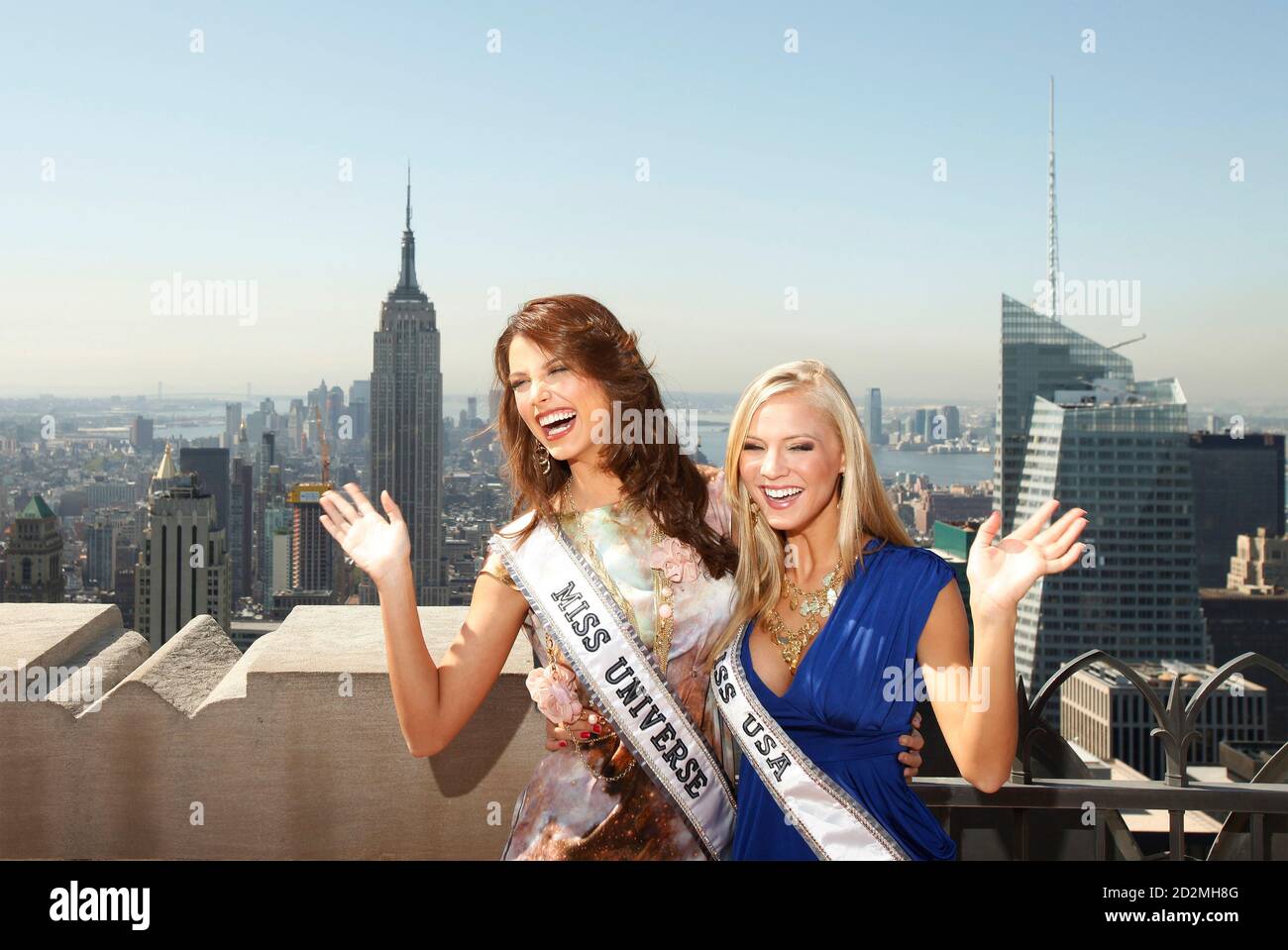 Miss Universe, Stefania Fernandez, of Venezuela and Miss USA, Kristen  Dalton (R), smile while posing for photographers on the "Top of the Rock"  observation deck at the Rockefeller Center in New York