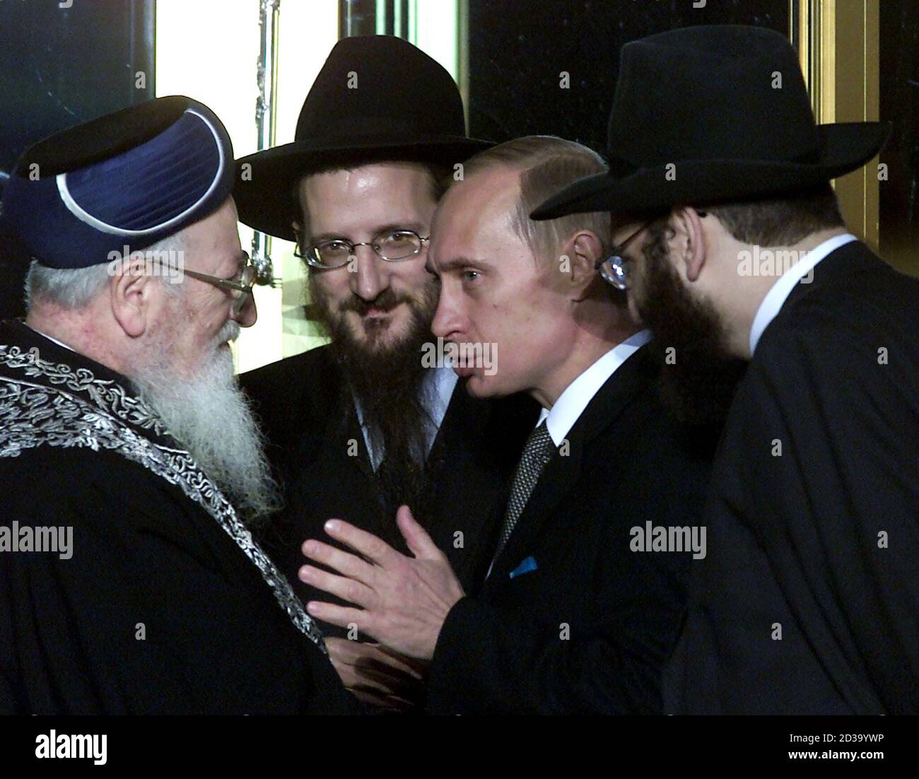 president-vladimir-putin-2r-speaks-with-russias-chief-rabbi-berl-lazar-2l-and-former-chief-sephardic-rabbi-of-israel-mordechai-eliahu-l-at-a-ceremony-opening-a-new-jewish-community-centre-in-moscow-september-18-2000-hundreds-of-russian-police-shut-down-an-area-of-several-city-blocks-on-monday-ahead-of-the-opening-of-the-centre-where-putin-was-to-give-the-keynote-address-the-person-at-right-is-unidentified-2d39ywp.jpg