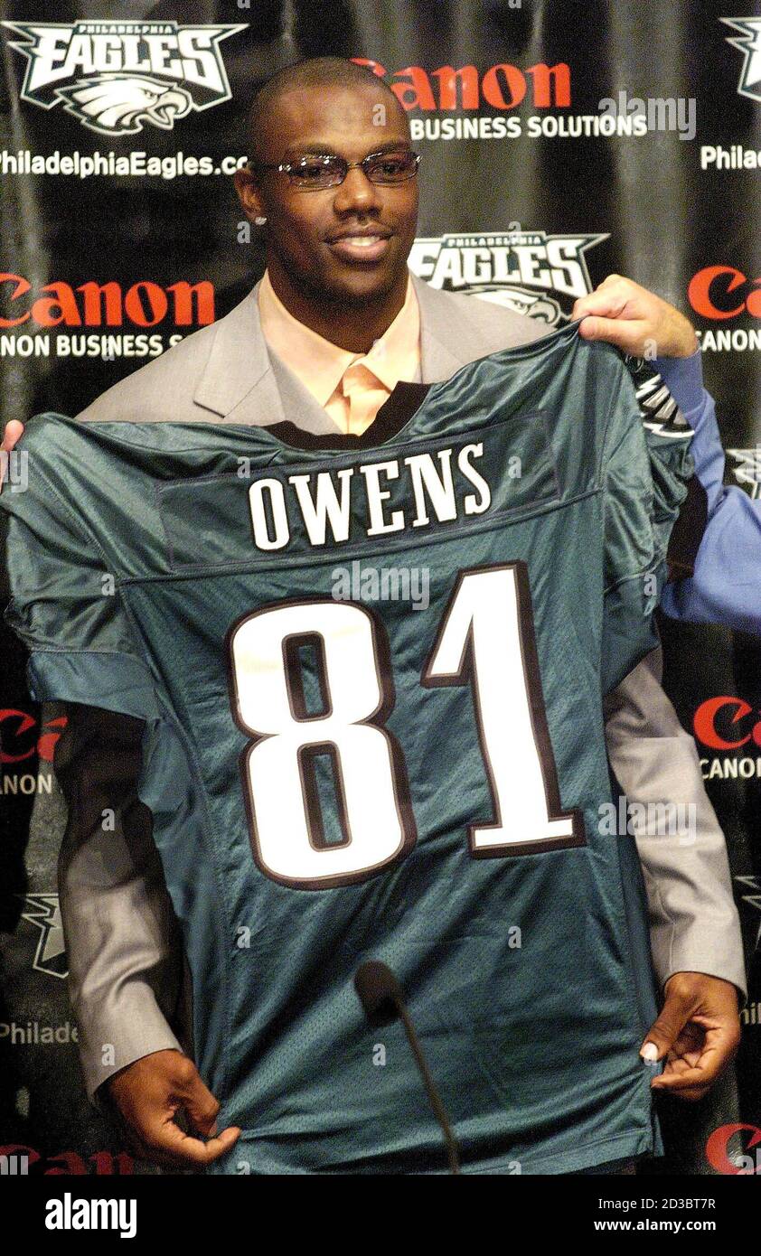 Wide receiver Terrell Owens holds up an Eagles jersey after signing with  the Philadelphia Eagles in Philadelphia, March 16, 2004. Owens was traded  to the Philadelphia Eagles on Tuesday in a three-way