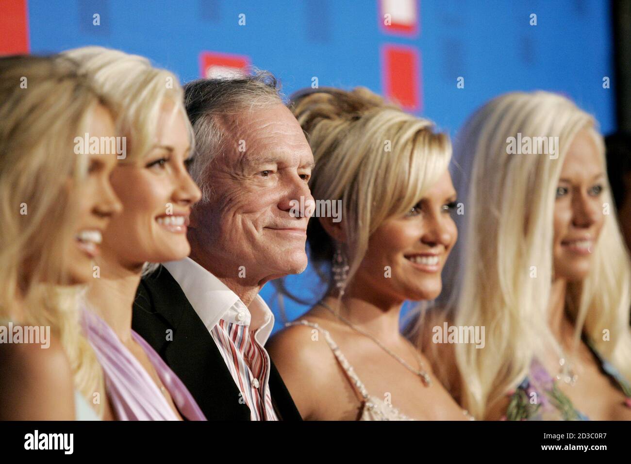 Playboy founder Hugh Hefner and his girlfriends arrive at the E