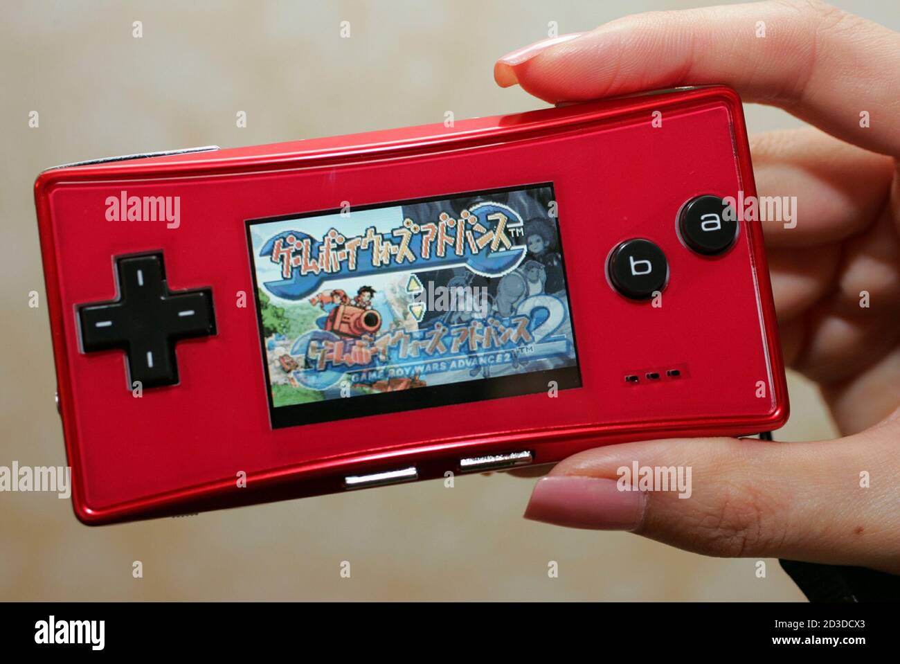 Nintendo Co Ltd unveils the Game Boy Micro handheld in Tokyo June 7, 2005.  The 2.8-ounce Micro handheld is about the size of a cellphone, and will  play all the same games