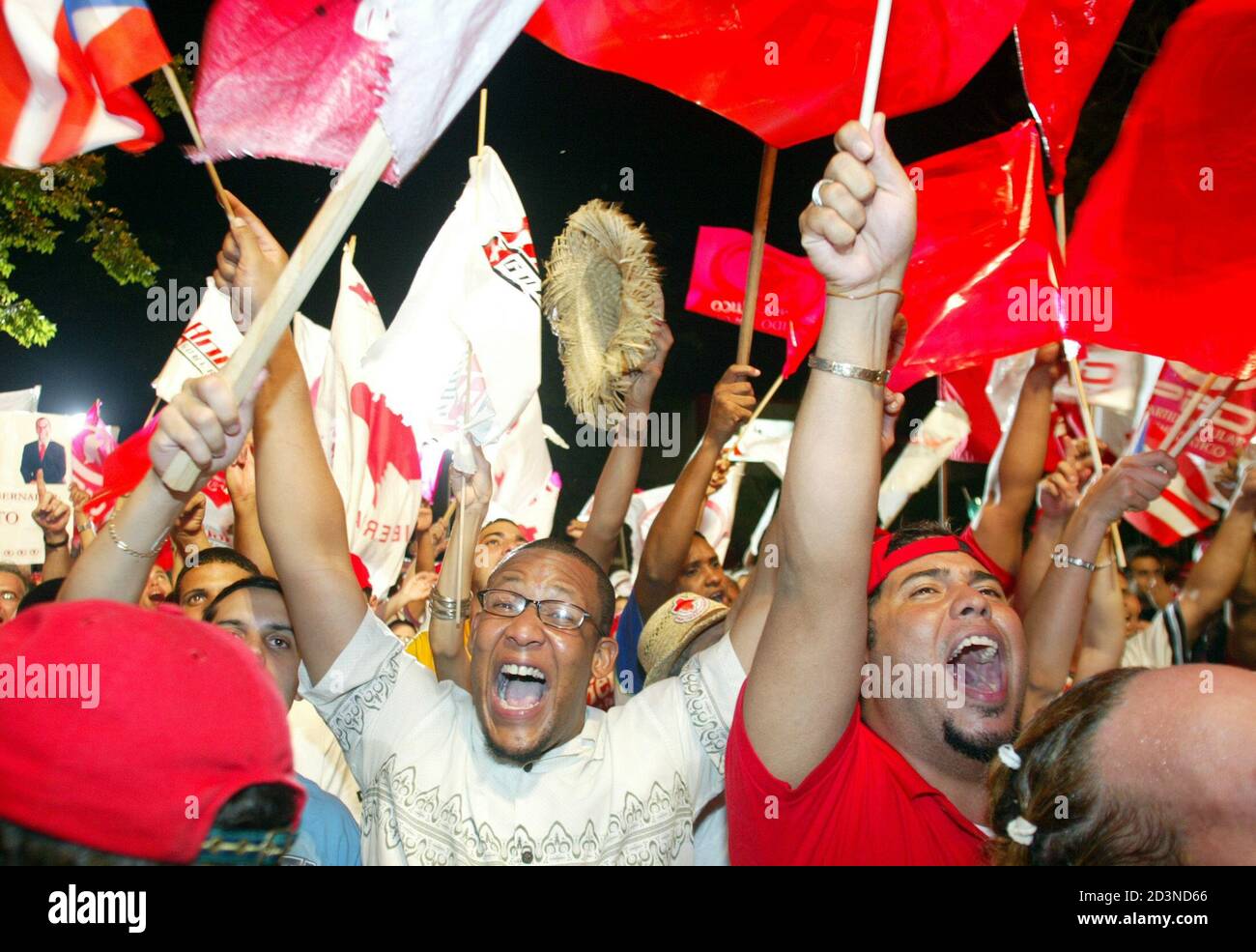 Puerto Ricans followers of the Popular Democratic Party celebrate after  hearing a small lead victory with 93.99 percent cast votes in one of the  most tightest elections in Puerto Rican political history