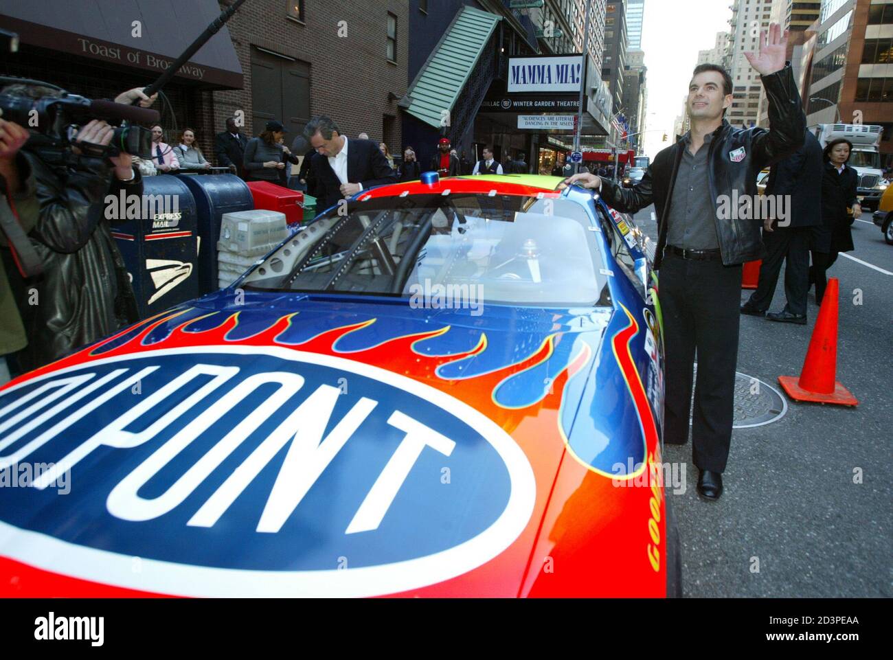 NASCAR driver Jeff Gordon waves to fans 