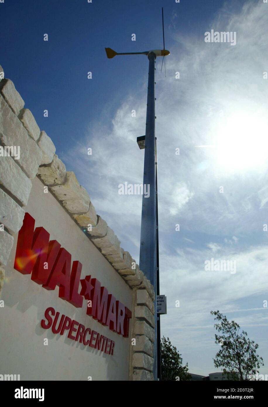 A Wind Turbine Used To Produce Electricity Spins Outside An Environmentally Friendly Wal Mart Concept Store In Mckinney Texas July 19 05 The Retail Giant Is Planning Two Experimental Stores In The U S That