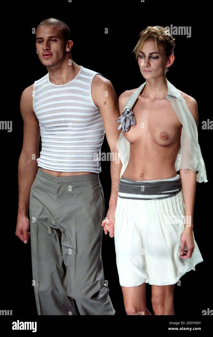 Models display men's and women's wear as part of the Emporio Armani  Spring/Summer ready-to-wear women's collection 2001 at a Milan fashion show  October 2, 2000 Fotografía de stock - Alamy