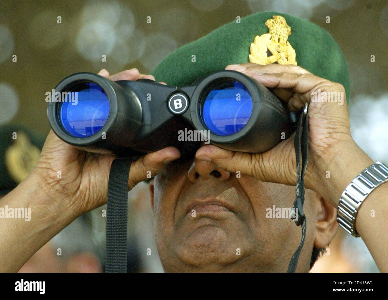 Indian army chief, N. C. Vij looks through binoculars during an