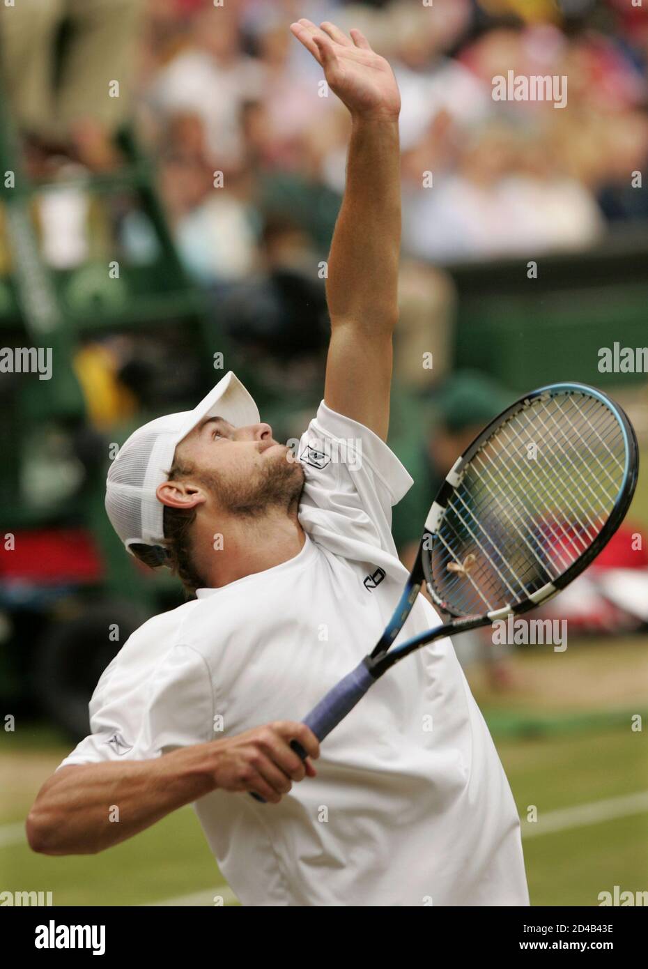 Second seed Andy Roddick of the U.S. serves to top seed Roger Federer of  Switzerland during their men's singles final match on Centre Court at the  Wimbledon Tennis Championships in London, July
