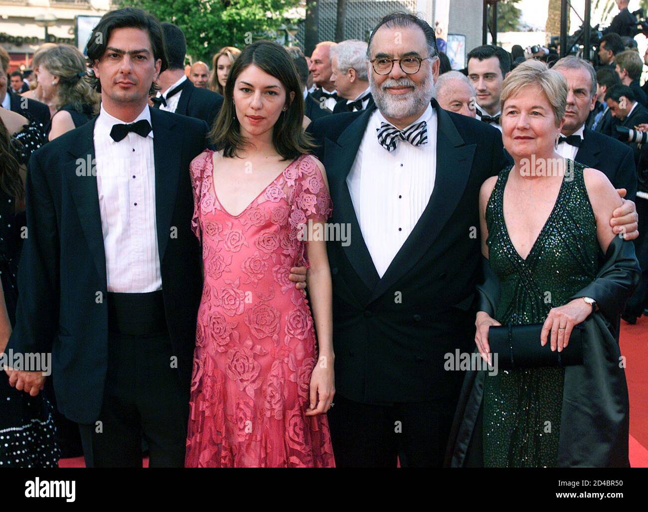 American director Francis Ford Coppola (2nd R) and his wife (R) arrive with his son Roman (L