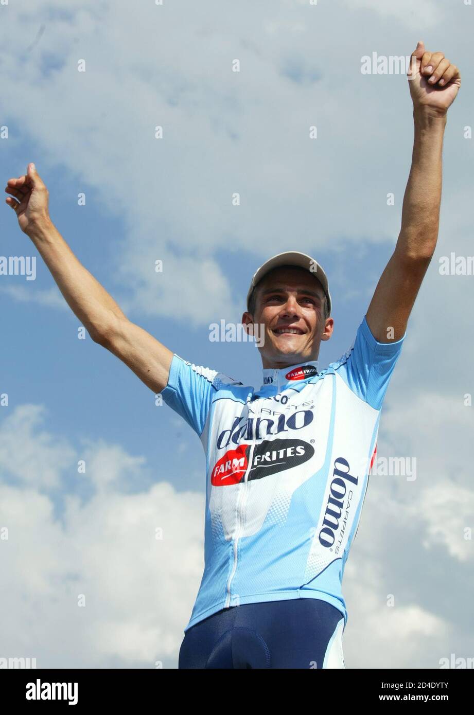 Domo team rider Richard Virenque of France celebrates on the podium after  winning the 221km fourteenth stage of the 89th Tour de France cycling race  from Lodeve to Mont-Ventoux July 21, 2002. [