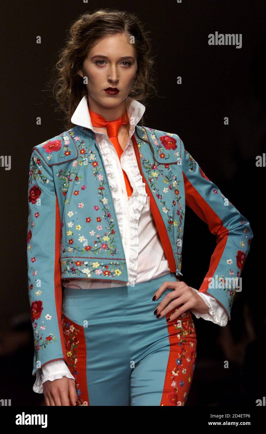 A model wears an outfit as part of Moschino Spring/Summer ready-to-wear  women's collection 2001 in Milan October 4, 2000. Italian fashion house  Moschino, which ties each of its shows to a specific