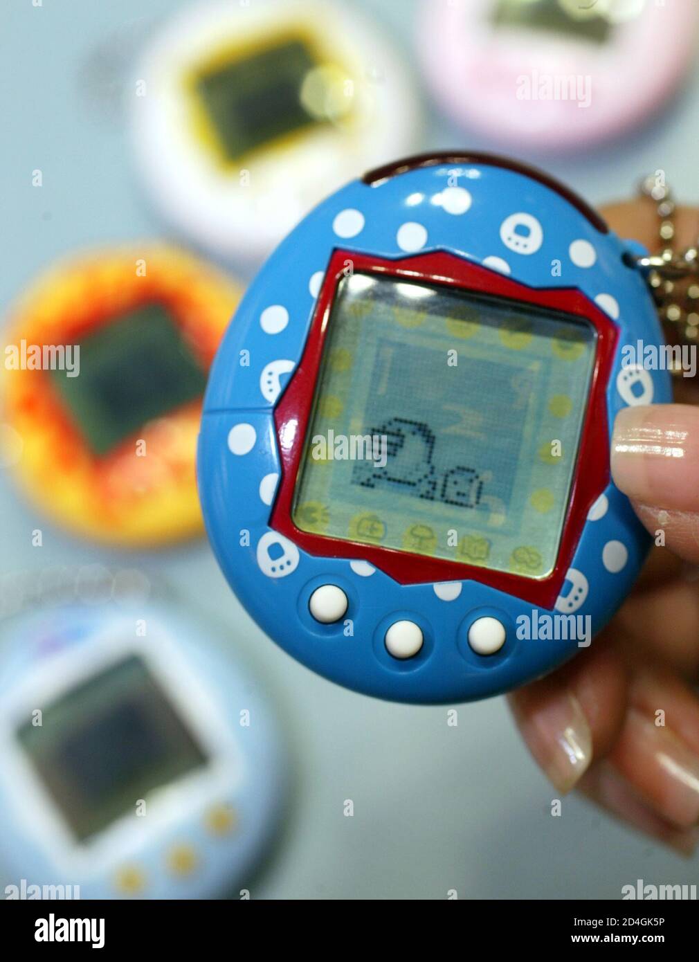 Bandai Co's new version of its virtual pet toy, "Returned Tamagotchi Plus"  are displayed at the company's headquarters in Tokyo February 4, 2004.  Japan's largest toymaker, Bandai's new Tamagotchi, which means "cute