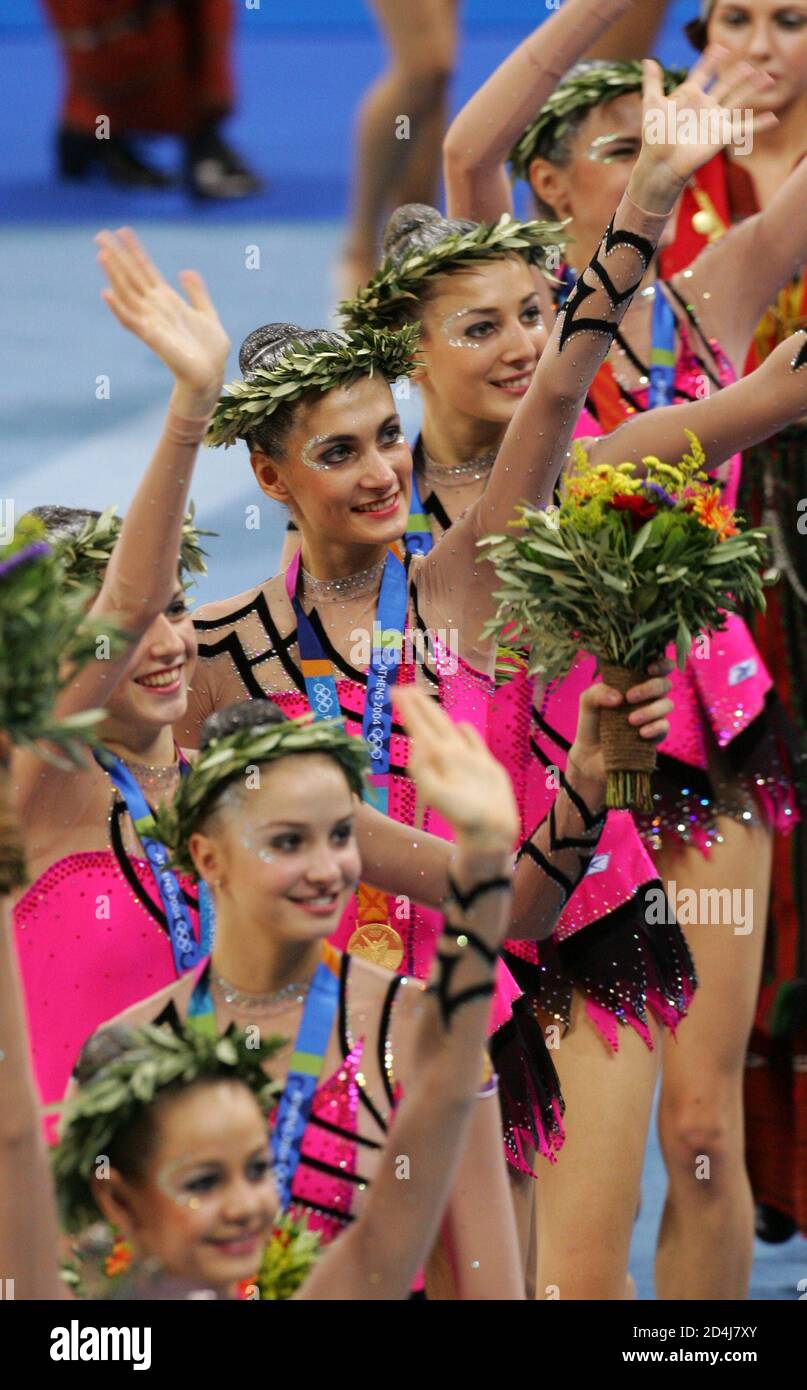Russian gymnasts show their gold medals in the allaround final of the