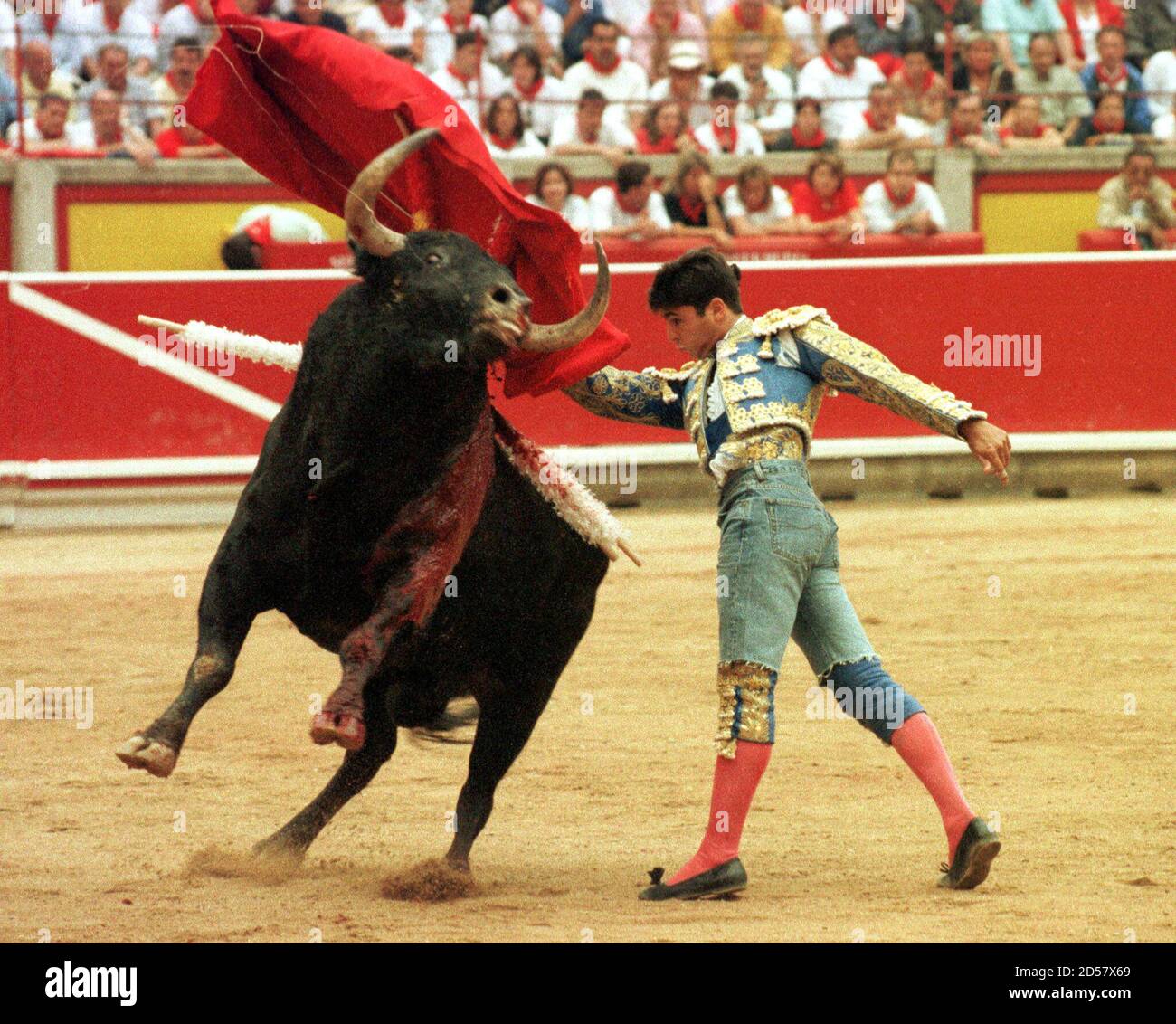 Fransisco Rivera Ordonez, one of the top Spanish matadors, performs a chest  pas with his bull named "Nordico" while wearing cutoff blue jeans July 13.  Earlier Ordonez was tossed by the bull