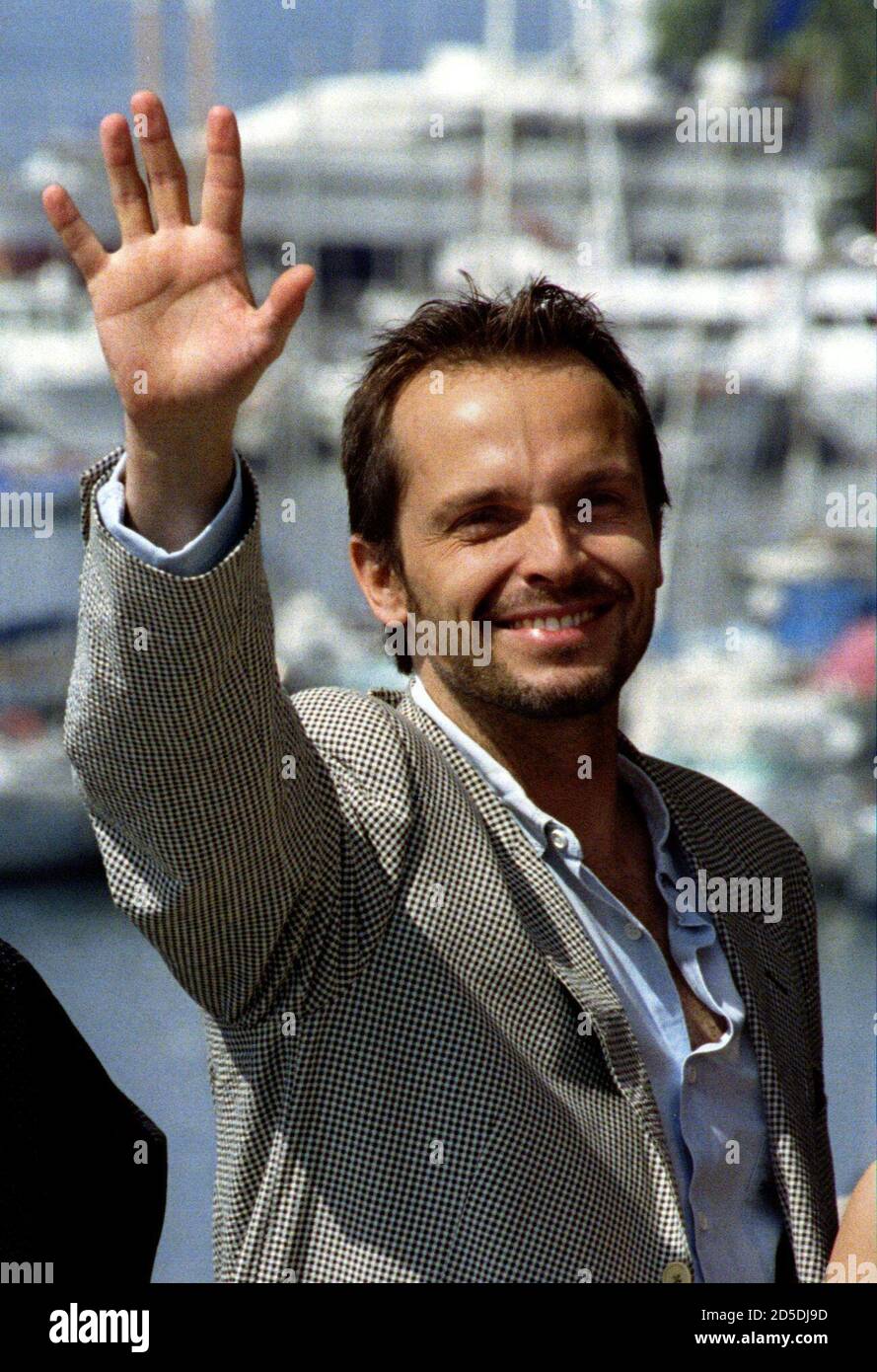 Miguel Bose of Spain waves during a photo call for French director  Bartabas' "Mazeppa" in competition at the 46th Cannes Film Festival, May  23. Actor Bose, also a singer with an international