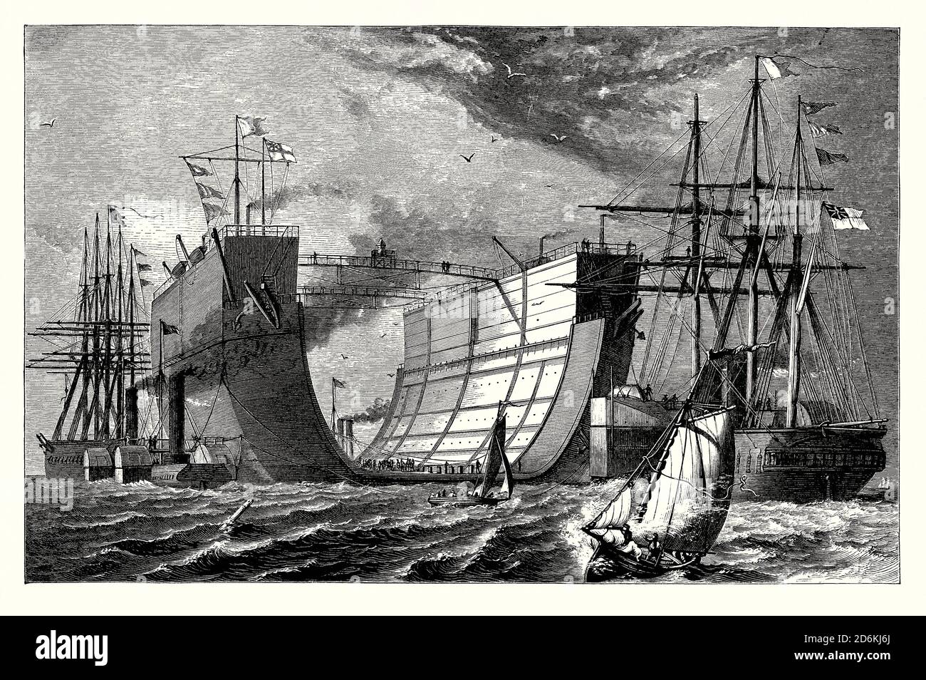 Un viejo grabado que muestra el dique seco flotante británico ‘Bermuda’ bajo remolque, dos herronclads haciendo el remolque, en el Océano Atlántico en 1869. Es de un libro victoriano de la década de 1880. El mantenimiento del casco de hierro requería un muelle seco en todo el mundo – se utilizaron versiones móviles flotantes. Bermuda fue construido en el astillero Campbell and Johnstone Thames. Fue lanzado en 1868. Las maniobras fueron asistidas por el HMS "terrible" (mostrado a la izquierda). Llegó a Bermuda en julio de 1869. El dique seco fue reemplazado por un nuevo muelle de acero en 1906. Sus restos aún son visibles frente a Spanish Point, Bermuda. Foto de stock
