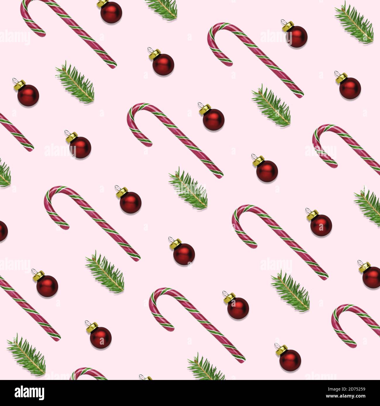 Ilustración 3D de fondo rosa de Navidad o año Nuevo con bastones de caña de caramelo, bolas rojas y ramas de abeto. Concepto de papel para envolver para el invierno Foto de stock