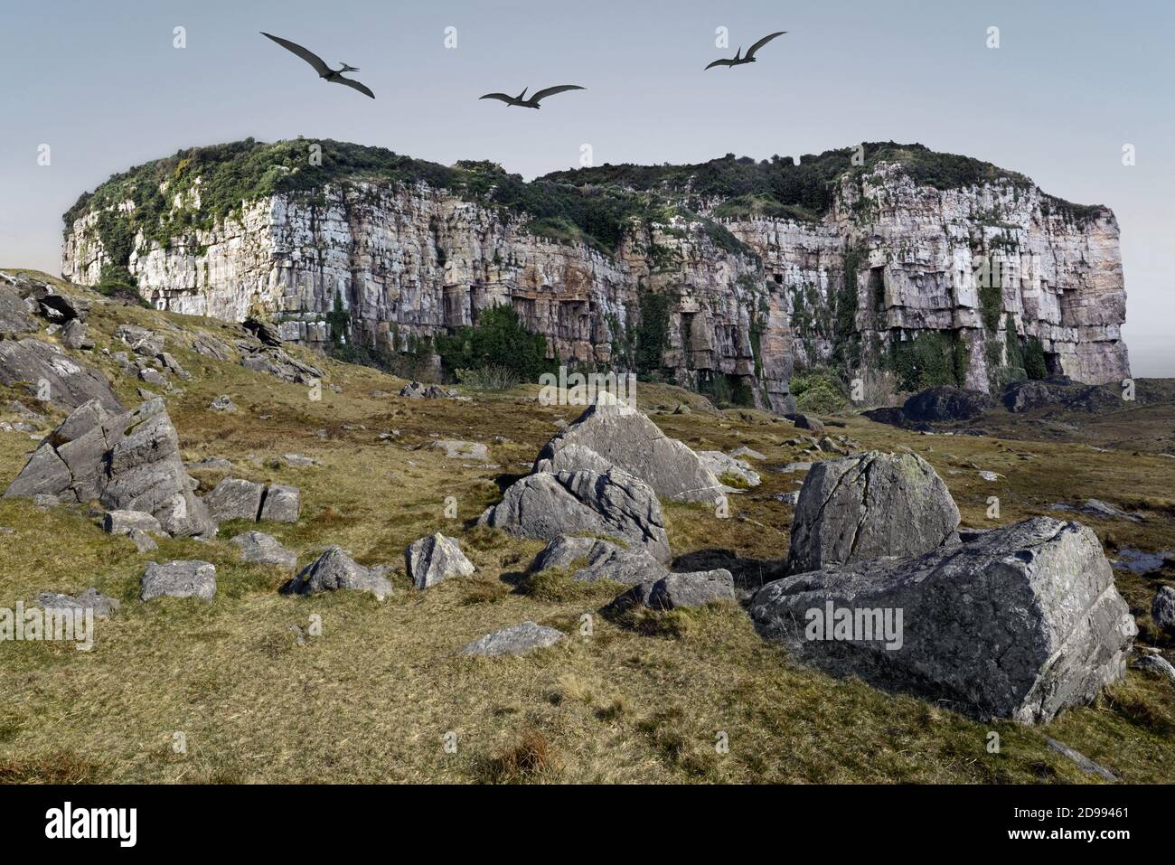 Una visión de fantasía del período Jurásico con pterodáctilos gigantes volando sobre una extraña montaña de mesa. Incluye Castle Rock, Anglesey y Snowdonia. Foto de stock