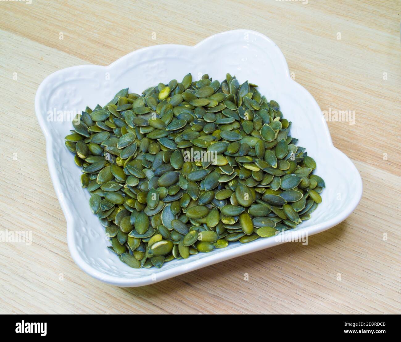 Semillas de calabaza - verde, semilla comestible de una calabaza después de  quitar la cáscara Fotografía de stock - Alamy