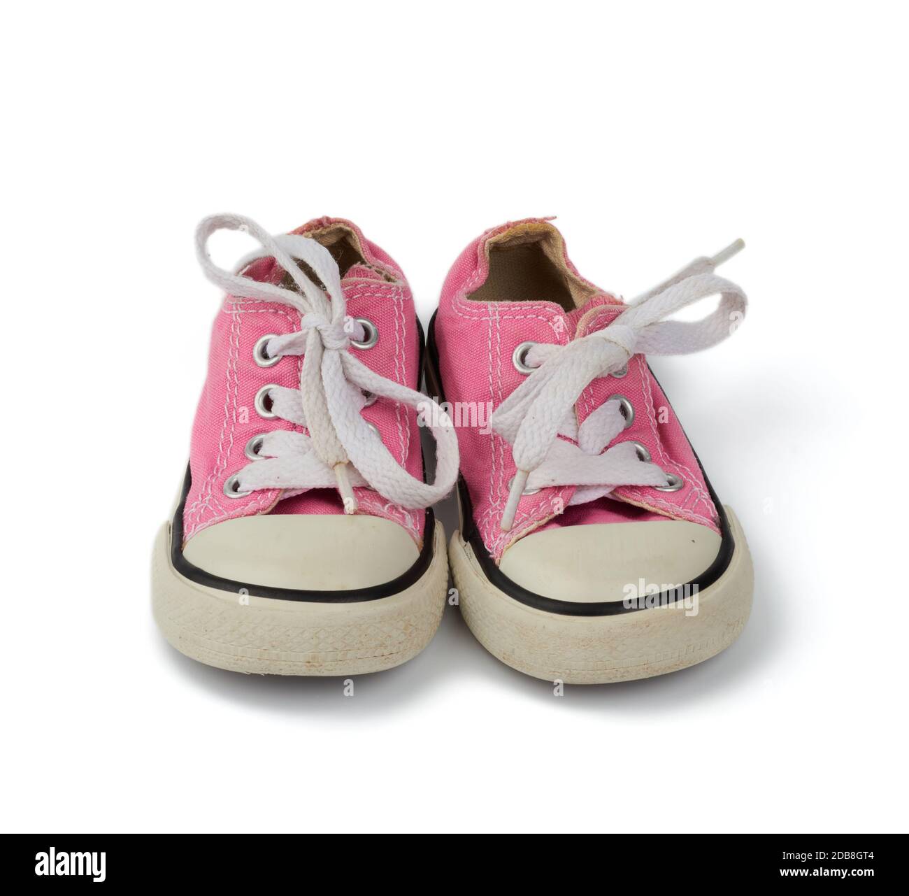 zapatillas de lona de color rosa para cordones aislados sobre un fondo blanco, zapatillas antiguas Fotografía de stock - Alamy