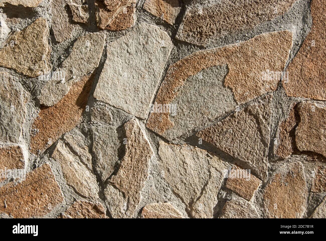 Losas de piedra arenisca fachada casa pared closeup como fondo de