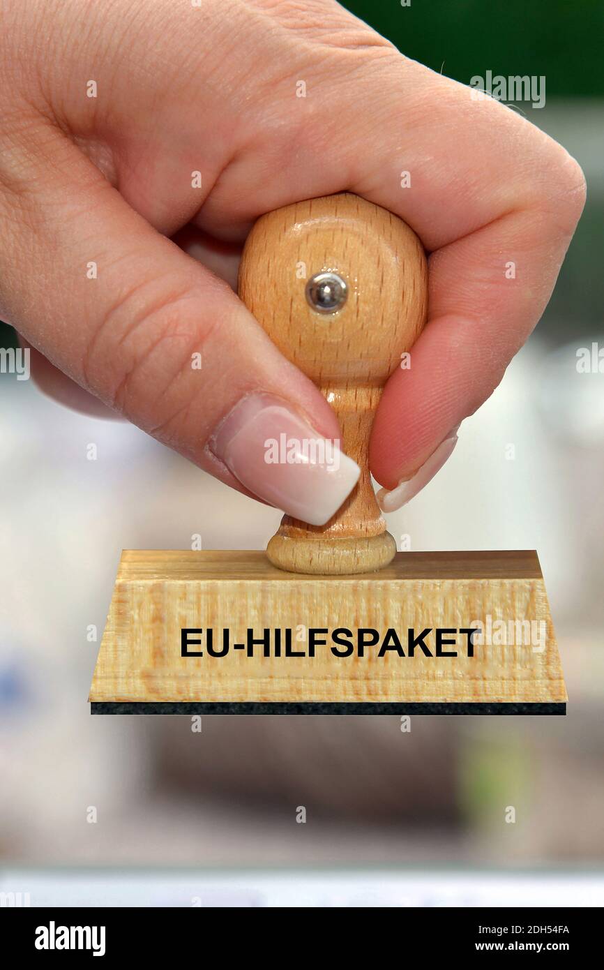 Hand mit Stempel, Frauenhand, Aufschrift: EU-Hilfspaket, Euro-Bonds, Foto de stock