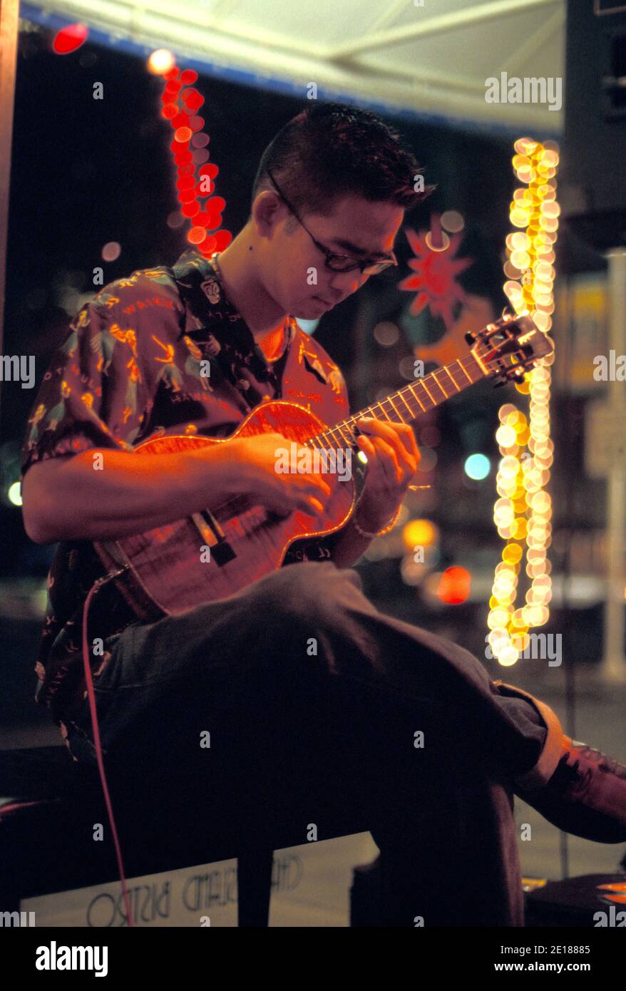 Local Hawaiian favorite ukulele maestro Jake Shimabukuro performing at Aloha Tower Foto de stock