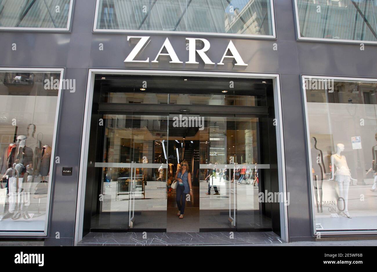 A woman leaves a Zara store in Barcelona June 13, 2012. Spain's Inditex SA,  the world's largest clothes retailer, bucked Europe's financial crisis with  a sharp rise in quarterly earnings by pleasing