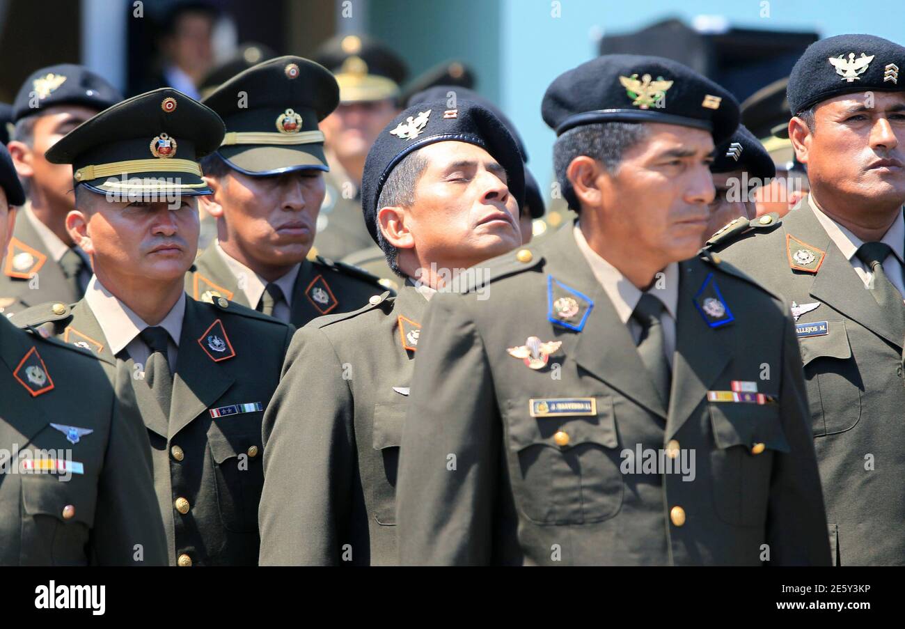 Peru's police officers are seen during the arrival of the coffins of  soldiers Juan Navarro and Constantino Ramos and policeman Lander Tamari at  an airport in Lima, April 15, 2012. Peru's Shining