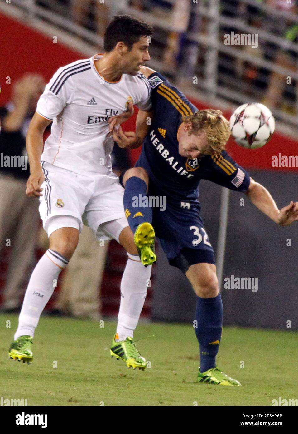 L A Galaxy S Jack Mcbean R Heads The Ball Away From Real Madrid S David Mateos During Their Guinness International Champions Cup Soccer Match In Phoenix Arizona August 1 13 Reuters Ralph D Freso United