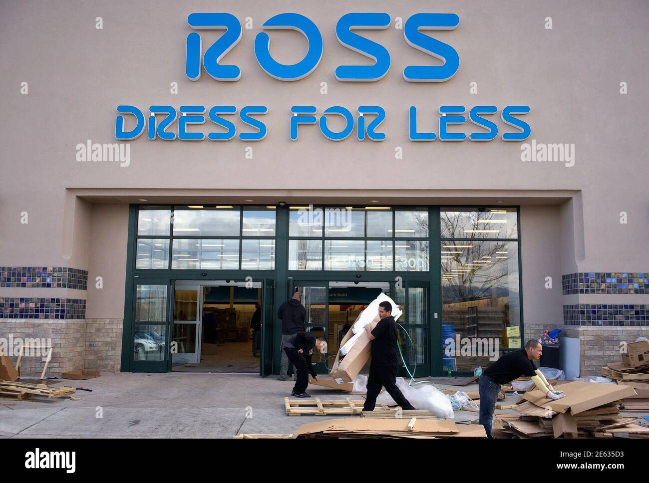 Workers prepare a new Ross store which is opening soon in Broomfield,  Colorado February 27, 2014. Ross Stores, Inc. will announce their quarterly  results on Thursday. REUTERS/Rick Wilking (UNITED STATES - Tags: