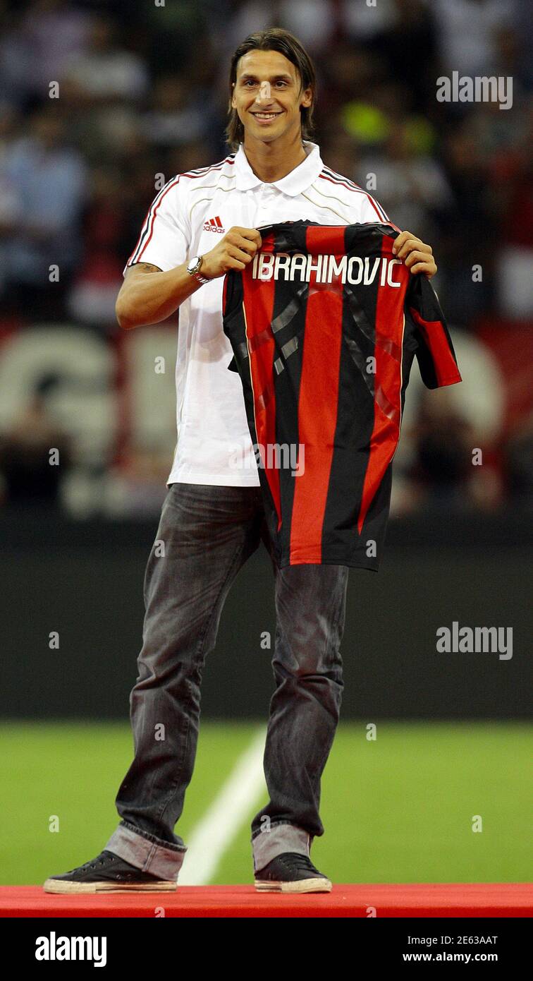 Swedish soccer player Zlatan Ibrahimovic holds an AC Milan jersey during a  presentation during the Italian Serie A soccer match between AC Milan and  Lecce at the San Siro stadium in Milan