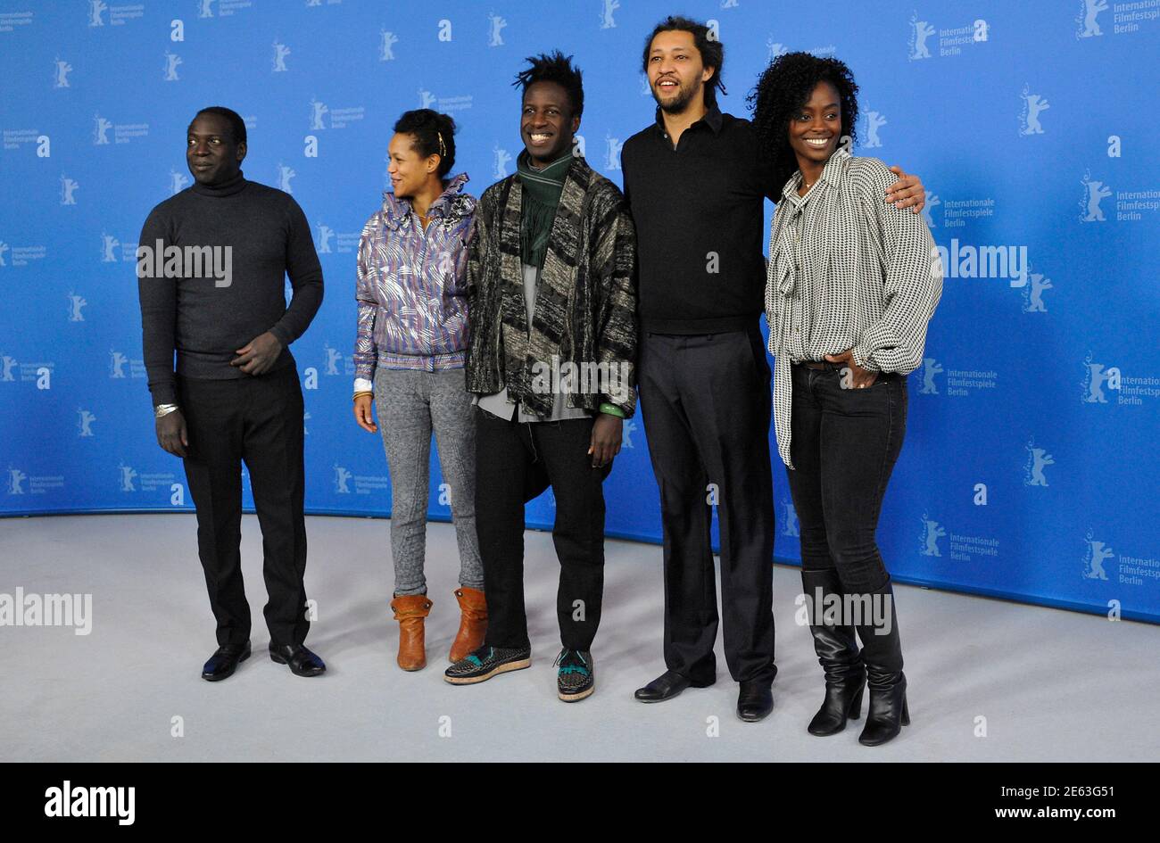 Actor Djolof M'bengue, actress Anisia Uzeyman, actor Saul Williams, director Alain Gomis and actress Aissa Maiga (L-R) attend a photocall to promote the movie "Aujourd'hui - Tey" at the 62nd Berlinale International Film Festival in Berlin February 10, 2012. REUTERS/Morris Mac Matzen (GERMANY - Tags: ENTERTAINMENT) Foto de stock