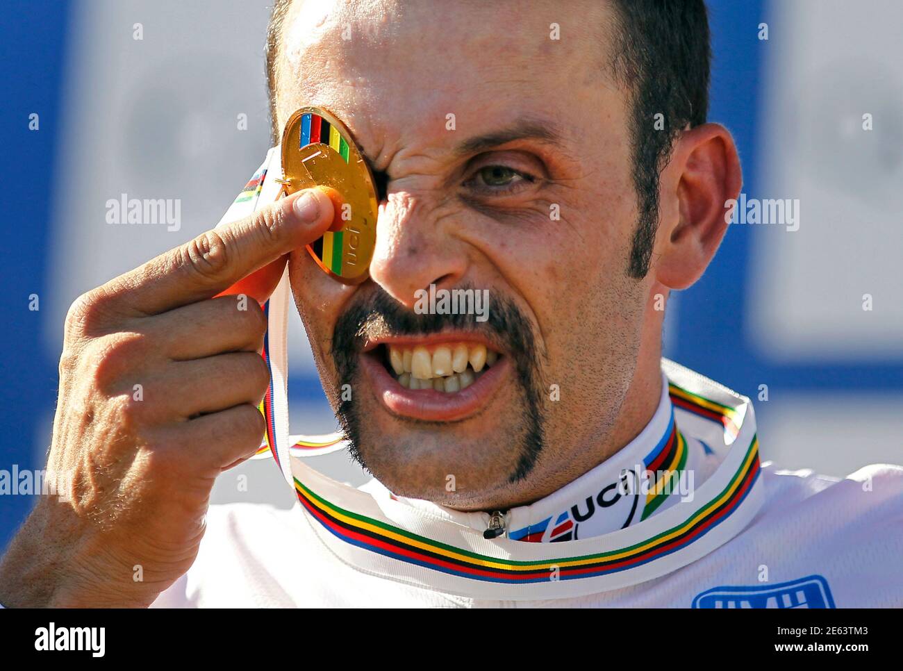 Spain's Jose Antonio Hermida Ramos covers his eye with his medal after  winning the men's cross country at the UCI Mountain Bike World  Championships in Mount Ste-Anne, Beaupre, September 4, 2010. REUTERS/Mathieu