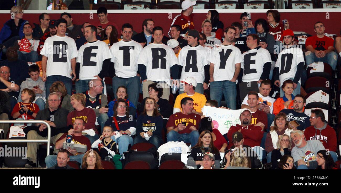 Cleveland Cavaliers fans in Cleveland, Ohio, wear shirts displaying the  word "Betrayed" to express their feelings towards LeBron James, who was  with the Cavaliers for seven years before leaving to play for