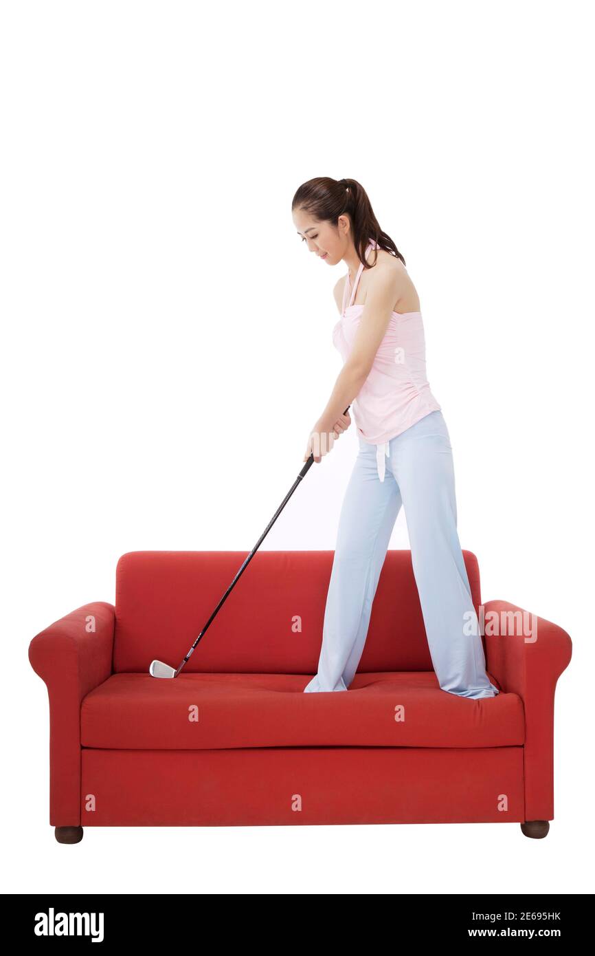Mujer de moda oriental con un club de golf foto de alta calidad Foto de stock