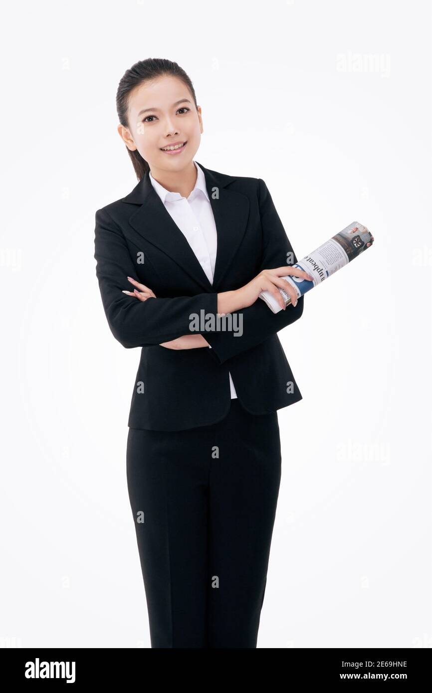 Mujer de negocios de moda con un periódico en inglés de alta calidad foto Foto de stock