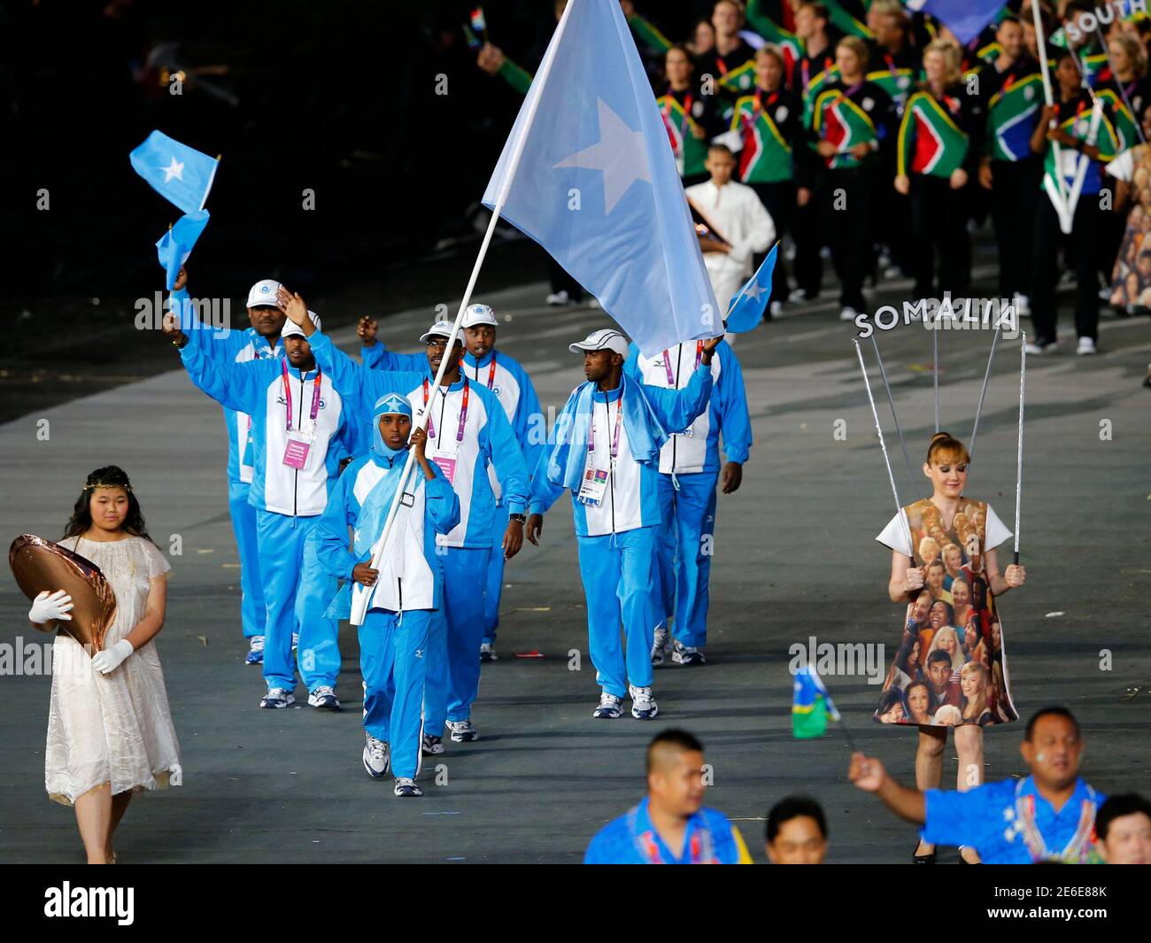 Somalia S Flag Bearer Zamzam Mohamed Farah Holds The National Flag As She Leads The Contingent In The Athletes Parade During The Opening Ceremony Of The London 12 Olympic Games At The Olympic