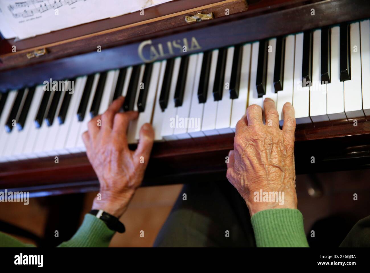 Pedro Rodriguez, 106, plays piano at home in Cangas de Onis, Asturias, in  northern Spain, July 9, 2016. Rodriguez plays piano every day in the living  room of the flat where he