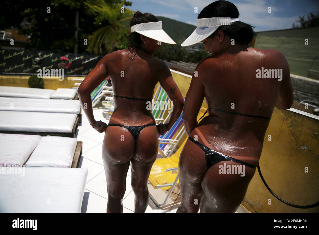 Women compare their bikini marks after sunbathing on a terrace to have the  perfect bikini mark ('marquinha' in Portuguese), at the Erika Bronze spa in  Rio de Janeiro, Brazil, November 22, 2016.