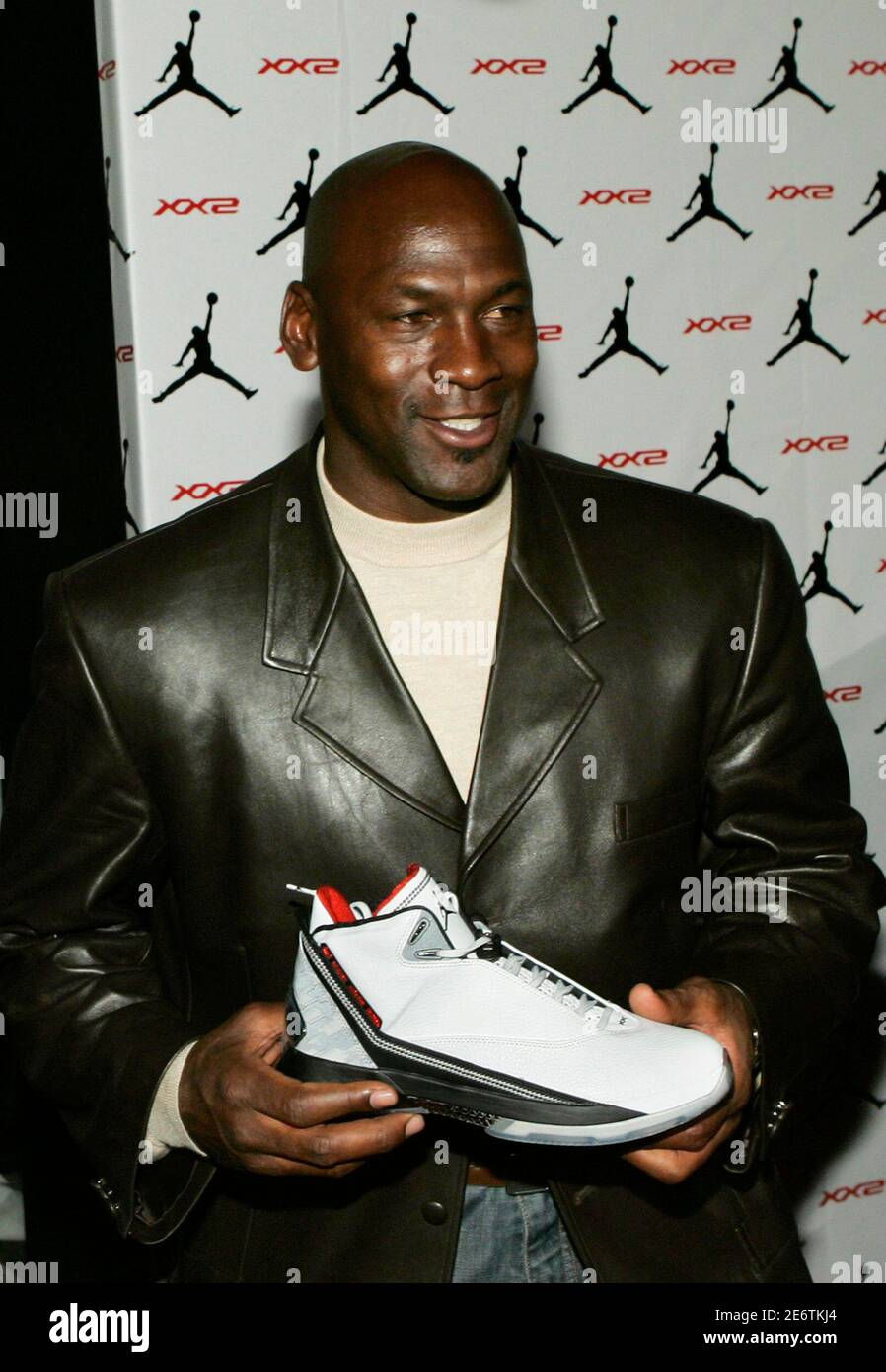 Michael Jordan holds an Air Jordan XX2 during a launch party for the new  shoe line at the MGM Grand Resort in Las Vegas, Nevada February 16, 2007.  The Jordan brand is